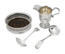 An Edwardian silver cream jug, a pair of sauce ladles and a wine coaster