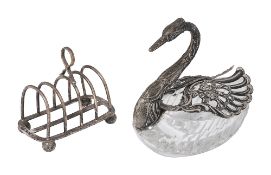 A German silver mounted crystal swan form bon bon dish and a toast rack