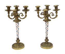 A pair of Louis XVI style gilt metal and porcelain candelabra
