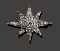 A diamond-set star brooch