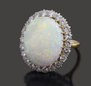 A large opal and diamond-set ring
