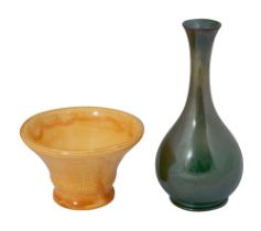 A Moorcroft pottery green lustre glazed bottle vase an orange mottled bowl
