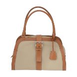 A Prada light beige canvas and tan leather handbag