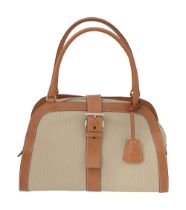 A Prada light beige canvas and tan leather handbag