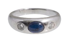 A sapphire and diamond three stone gypsy ring