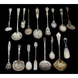 A collection of mostly continental silver sifter spoons