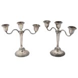 A pair of Elizabeth II silver three light candelabra