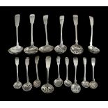 A collection of mostly George III/IV silver fiddle pattern sifter spoons