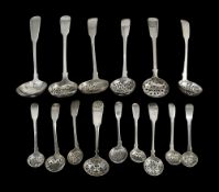 A collection of mostly George III/IV silver fiddle pattern sifter spoons