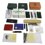 A collection of spare watch boxes, straps and accessories