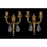 A pair of Louis XVI style gilt metal wall lights