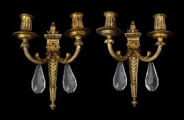 A pair of Louis XVI style gilt metal wall lights