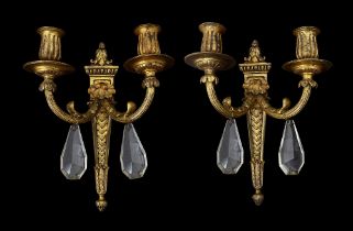 A pair of Louis XVI style gilt metal wall lights