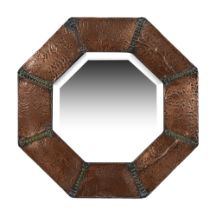 An Arts and Crafts octagonal copper wall mirror