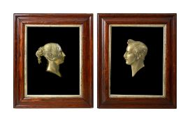 Two Victorian framed brass profile portraits of Queen Victoria and Prince Albert
