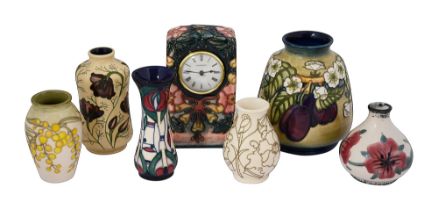 A modern Moorcroft oberon pattern clock and a collection of vases