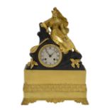 A Charles X gilt brass and metal mantel clock