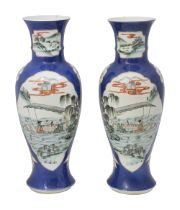 A pair of Chinese powder blue ground famille verte vases