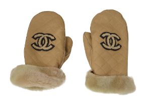 A pair of light beige sheepskin Chanel mittens