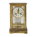 A late 19th century French gilt brass four glass mantle clock