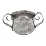 A late Victorian Arts and Crafts Britannia standard silver porringer