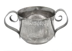A late Victorian Arts and Crafts Britannia standard silver porringer