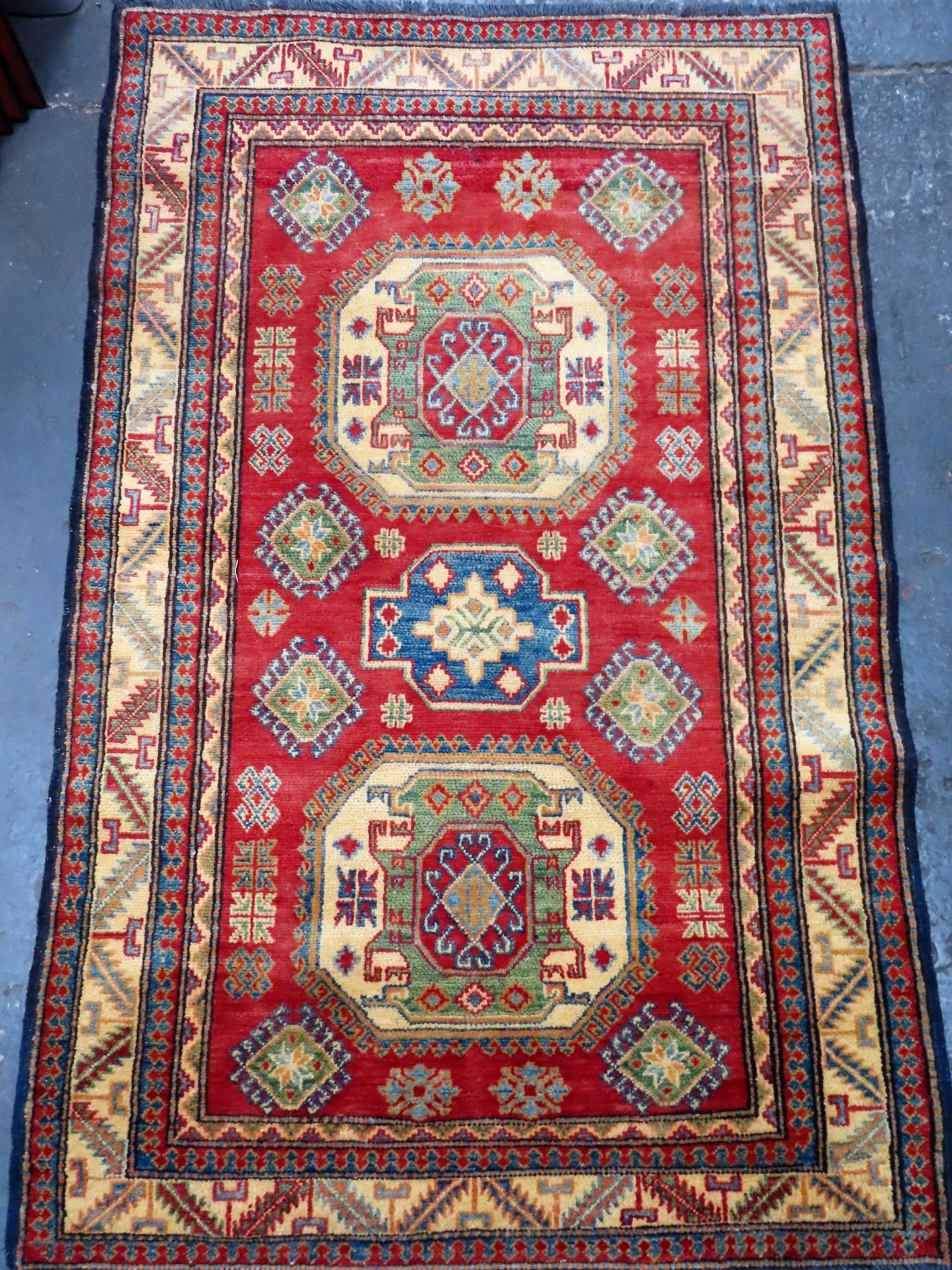 Decorative Middle Eastern style floor rug. Approx. 183cms x 114cms reasonable used condition