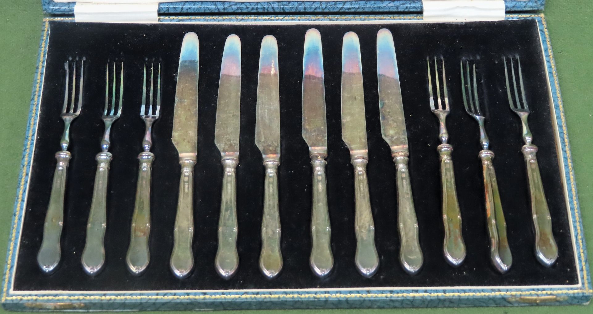 Cased set of six hallmarked silver handled knives and forks All in used condition