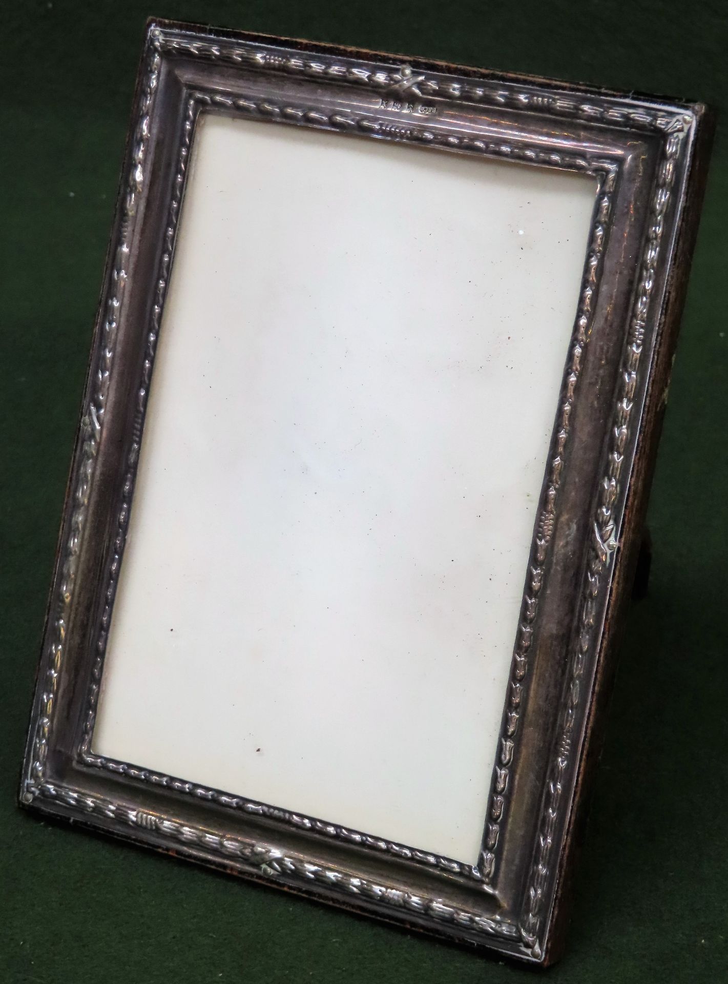 Small hallmarked silver photo frame, Birmingham assay. App. 17 x 13cm Appears in reasonable used