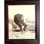 OLD SEPIA PHOTOGRAPH OF A SHRIMPER ON A ROCK, APPROX 53 x 42cm