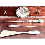 THREE SILVER HANDLED ITEMS, TWO BUTTON HOOKS AND SHOE HORN PLUS SILVER PLATED MILITARY FIGURE PIN