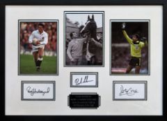 Framed display - Hand signed by Rory Underwood, Peter Shilton & Bob Champion. Approx. 35cmsx 50cms