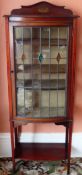 Late 19th century bow fronted mahogany single door glazed display cabinet. App. 147cm H x 56cm W x