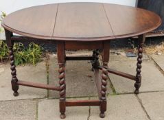 Oak barley twist gate leg dining table. App. 73cm H x 132cm W x 105cm D Reasonable used condition,