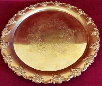 GILT METAL CIRCULAR REPOUSSE DECORATED SERVING TRAY. APP. 36.5CM DIAMETER REASONABLE USED CONDITION