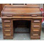 Early 20th century oak seven drawer roll top writing desk. App. 100cm H x 102cm W x 67cm D