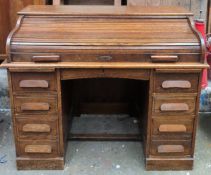 Early 20th century oak seven drawer roll top writing desk. App. 100cm H x 102cm W x 67cm D