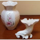 Two pieces of Belleek pottery. Largest App. 21cm H Both appear in reasonable used condition