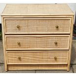 Three drawer rattan style chest of drawers. App. 72cm H x 79cm W x 45.5cm D Reasonable used