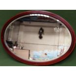 Mahogany bevelled and inlaid oval wall mirror. App. 57 x 82cm Reasonable used condition