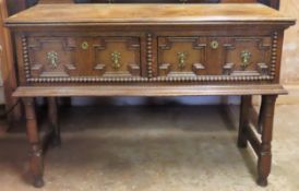 Late 19th/early 20th century oak two drawer dresser base. Approx. 82cms H x 119cms W x 46cms D