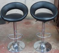 Pair of 20th century upholstered chrome adjustable barber chairs. Total height app. 101cm H Both