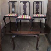 Mahogany draw leaf dining table with three ebonised dining chairs. Table Approx. 77cms H x 181cms