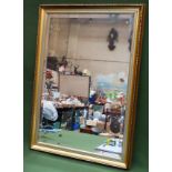 20th century gilded and bevelled wall mirror. Approx. 75cms x 49cms reasonable used condition