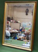 20th century gilded and bevelled wall mirror. Approx. 75cms x 49cms reasonable used condition