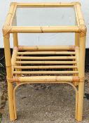 Bamboo two tier glass topped side table. App. 56cm H x 41cm Diameter Reasonable used condition,