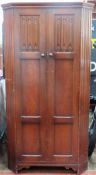 Early 20th century oak linen fold fronted two door wardrobe by Gomme Ltd (G Plan). App. 181cm H x