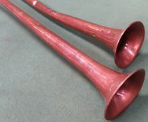 Pair of vintage copper and brass hunting horns. Largest Approx. 127cms L both are dented throughout