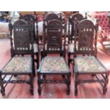 Set of six heavily carved barley twist oak high back chairs, each decorated with historical figures.