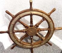 MAHOGANY AND BRASS SHIP'S WHEEL WITH CLOCK INSET TO CENTRE